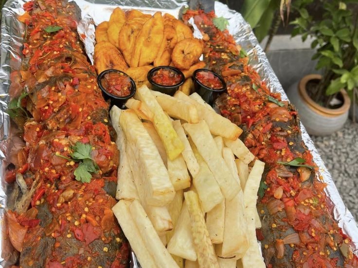 Grilled fish with fried yam and plantain